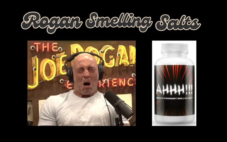 Joe Rogan reacting to smelling salts with a bottle of Ahhh!!! World's Strongest Smelling Salts displayed next to him